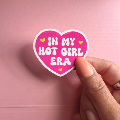 pink heart vinyl sticker with the phrase "in my hot girl era" with three smaller green hearts