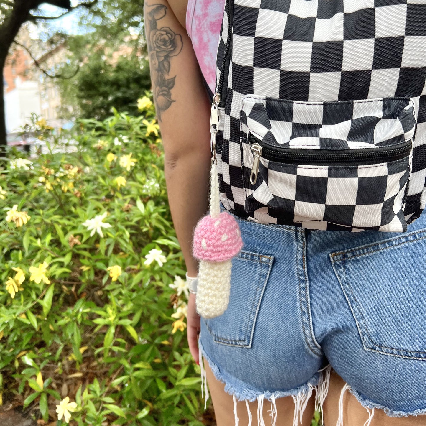 pink and white crochet mushroom keychain. holds chapstick, lighters, lip gloss, crystals, money and more